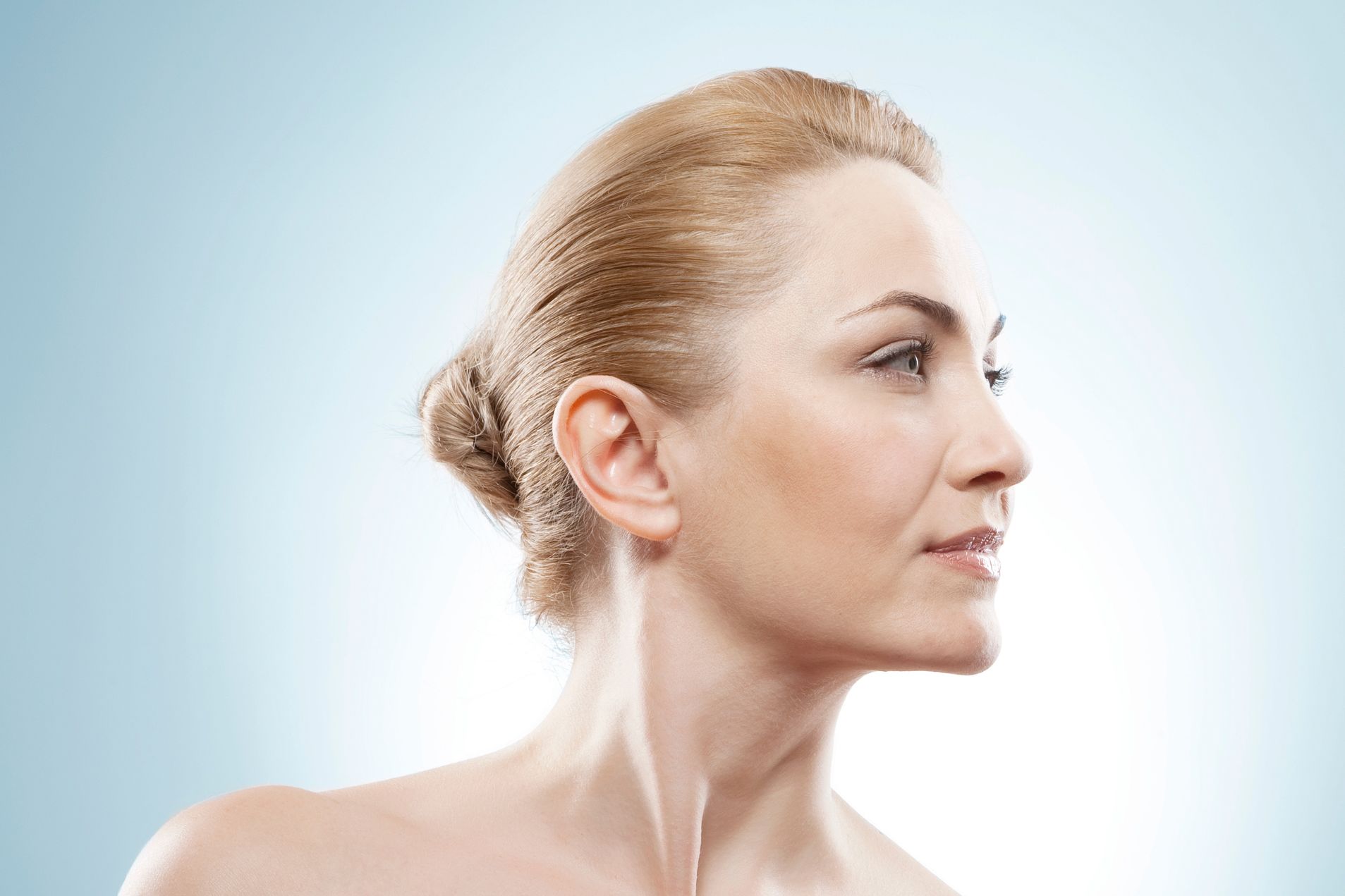 Patient's side profile, accentuating chin and neck.